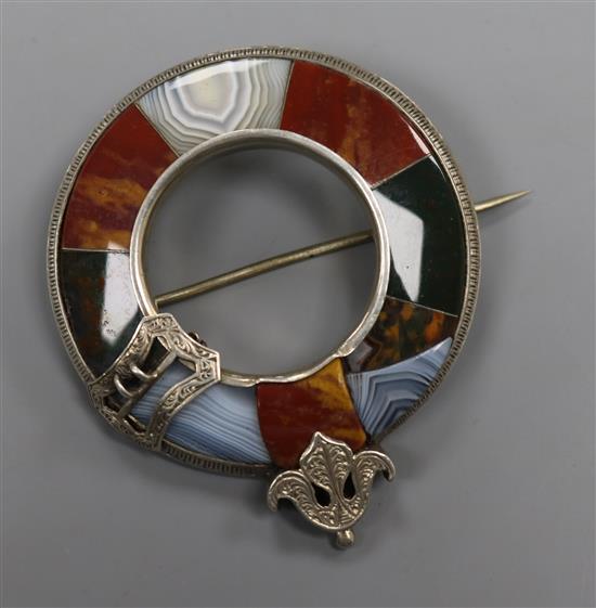 An early 20th century white metal and Scottish hardstone brooch, 52mm.